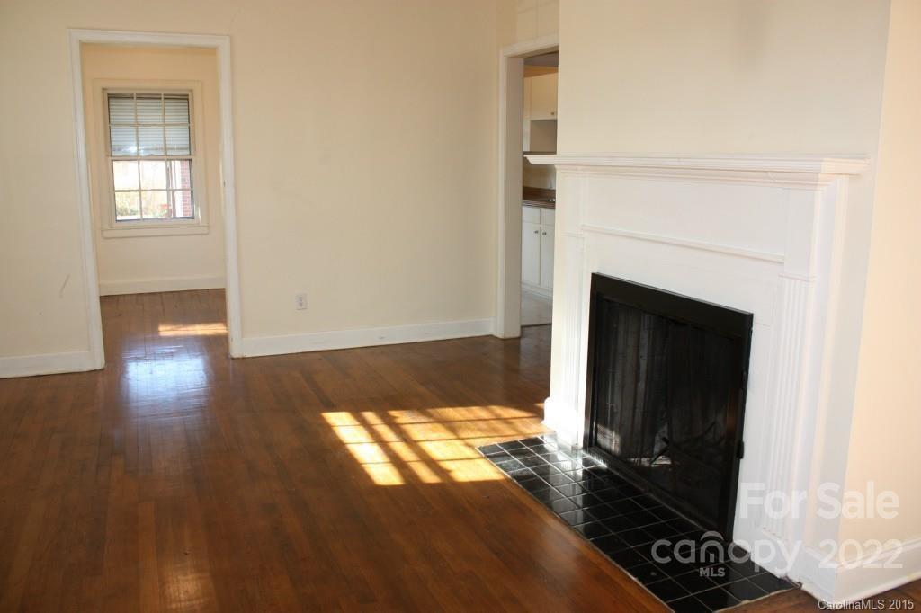 1436 Kimberly Road Charlotte, NC 28208 - Photo 4 of 6 a view of a living room with wooden floor