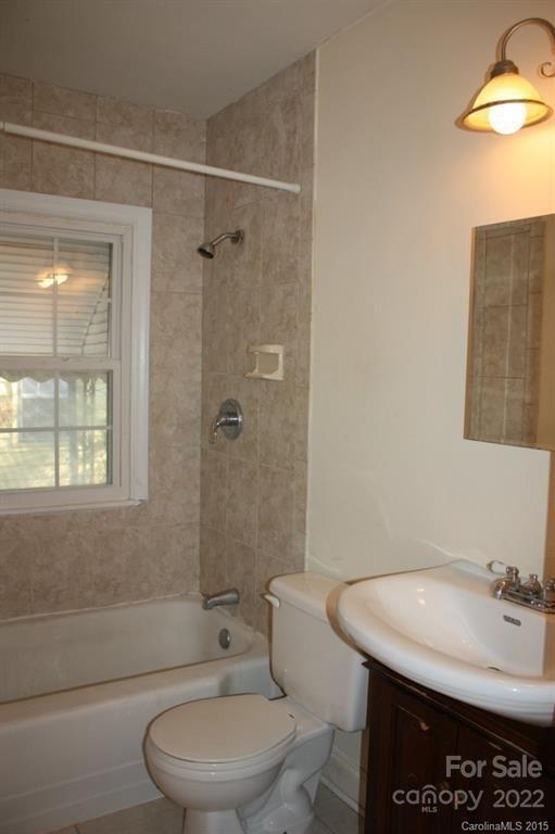 1436 Kimberly Road Charlotte, NC 28208 - Photo 6 of 6 a bathroom with a sink a toilet and shower