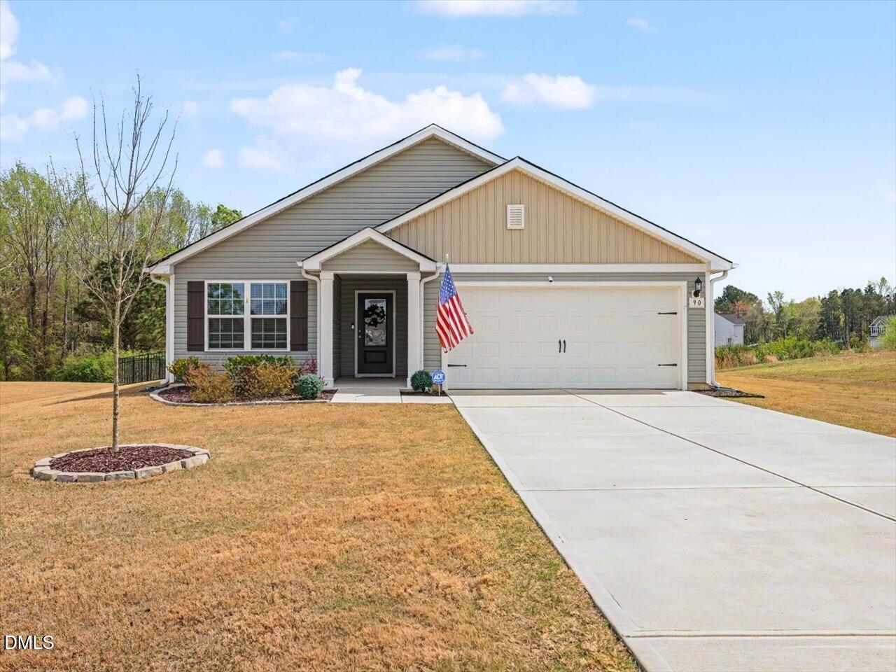 90 Barnsley Road Angier, NC 27501 - Photo 1 of 40 a view of a house with a small yard and large tree