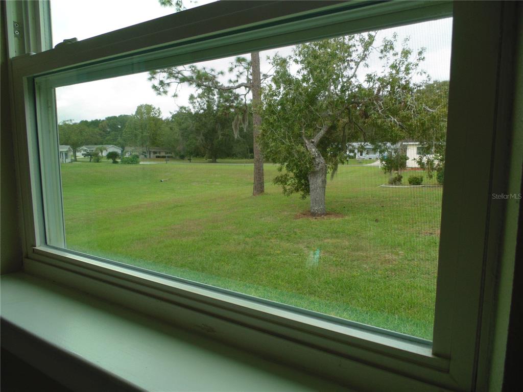 10856 Southwest 79th Avenue Ocala, FL 34476 - Photo 25 of 33 a view of lot of trees from a window