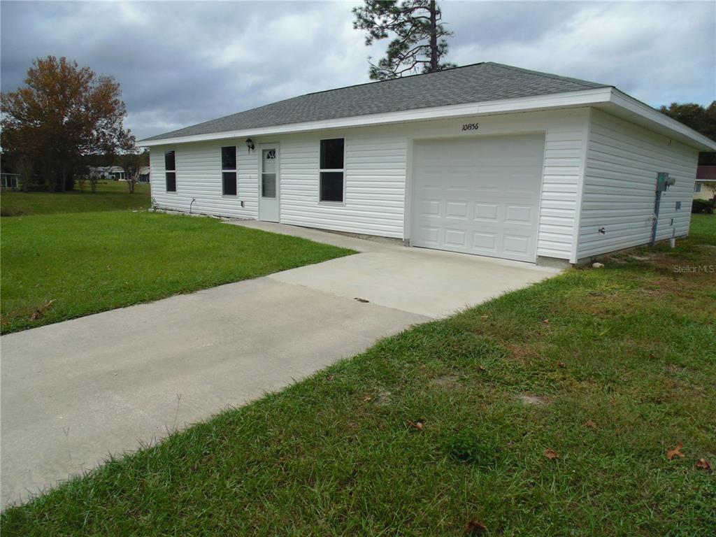 10856 Southwest 79th Avenue Ocala, FL 34476 - Photo 27 of 33 a front view of house with yard and tree
