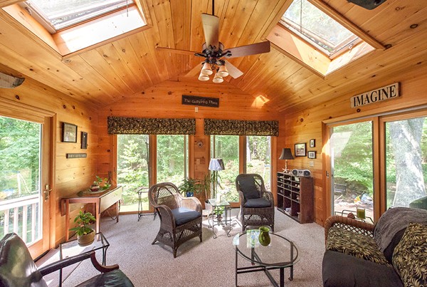 31 Chapman Road Boxford, MA 01921 - Photo 13 of 27 a living room with furniture and a large window
