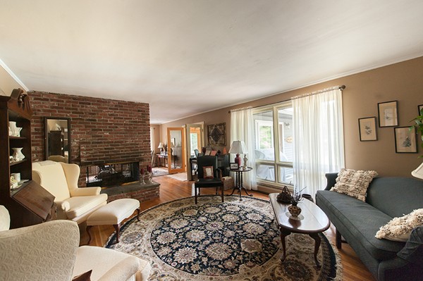 31 Chapman Road Boxford, MA 01921 - Photo 14 of 27 a living room with furniture windows and a fireplace