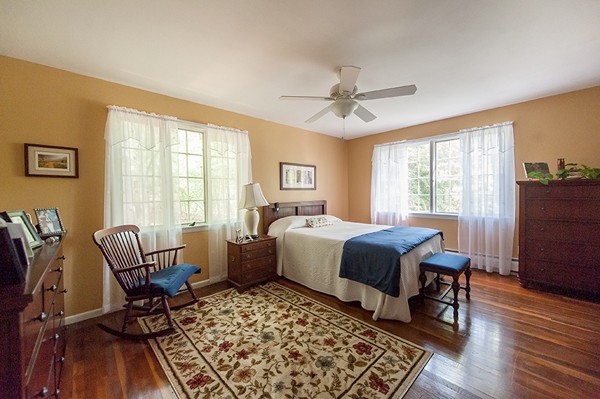 31 Chapman Road Boxford, MA 01921 - Photo 16 of 27 a bed room with a bed and a chair