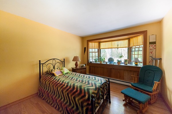 31 Chapman Road Boxford, MA 01921 - Photo 18 of 27 a bedroom with a bed and a large window with outer view