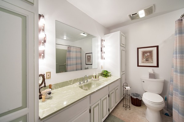 31 Chapman Road Boxford, MA 01921 - Photo 19 of 27 a bathroom with a granite countertop sink mirror vanity and toilet