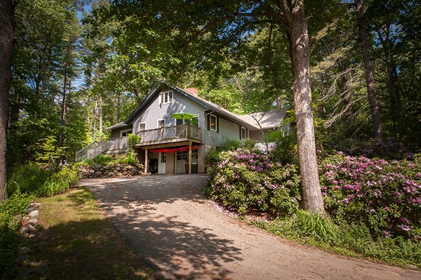 31 Chapman Road Boxford, MA 01921 - Photo 3 of 27 a front view of a house with a yard and garage