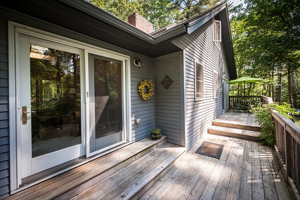 31 Chapman Road Boxford, MA 01921 - Photo 5 of 27 a yellow house with outdoor space