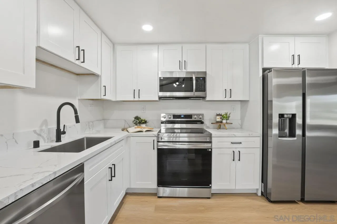 23471 Japatul Valley Road Alpine, CA 91901 - Photo 14 of 57 a kitchen with stainless steel appliances granite countertop a refrigerator sink and microwave