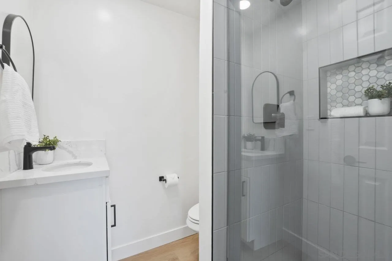 23471 Japatul Valley Road Alpine, CA 91901 - Photo 22 of 57 a bathroom with a shower sink and mirror