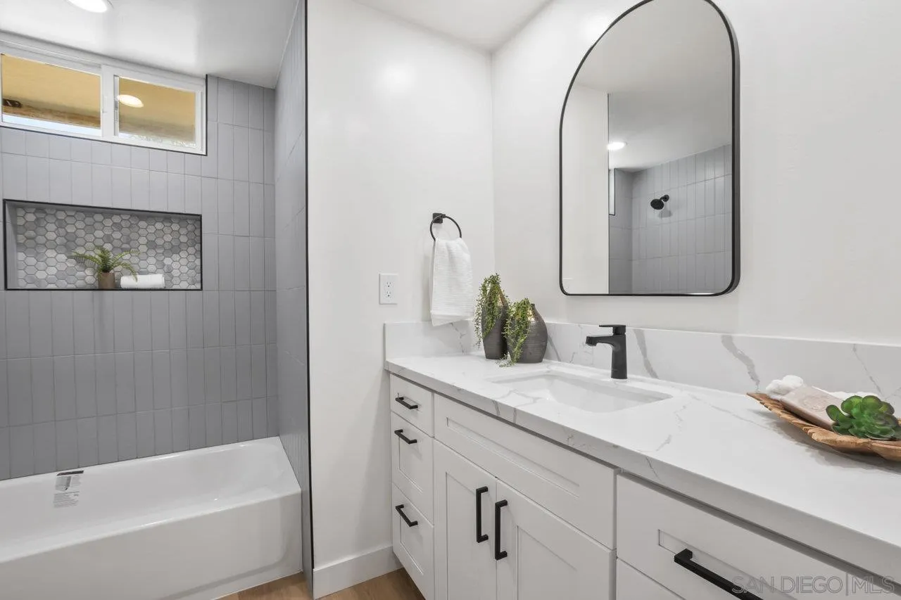 23471 Japatul Valley Road Alpine, CA 91901 - Photo 23 of 57 a bathroom with a sink and a mirror