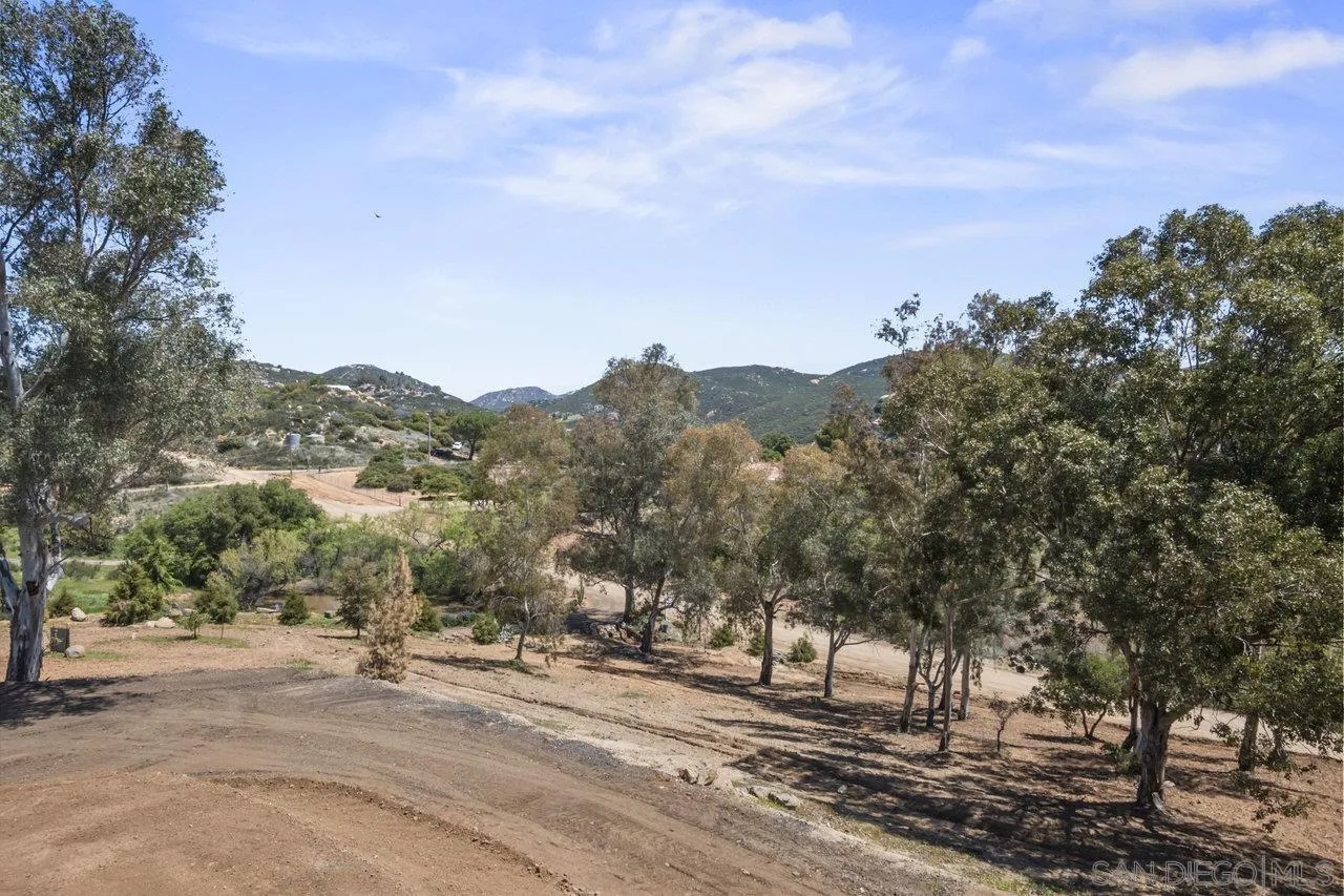 23471 Japatul Valley Road Alpine, CA 91901 - Photo 34 of 57 a view of a town with mountains in the background
