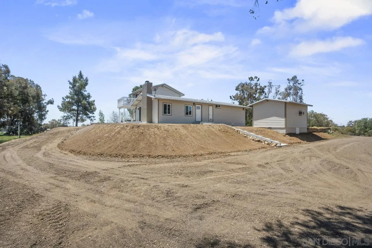 23471 Japatul Valley Road Alpine, CA 91901 - Photo 37 of 57 a view of a house with a yard