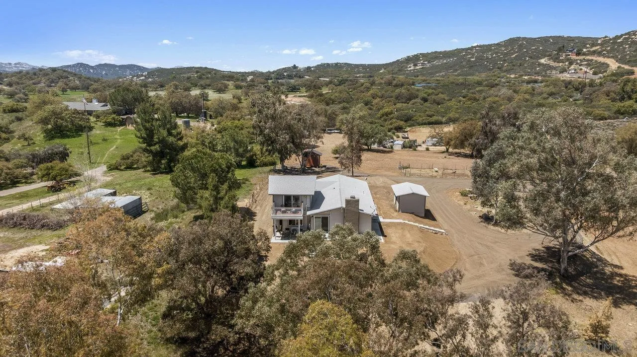 23471 Japatul Valley Road Alpine, CA 91901 - Photo 50 of 57 an aerial view of residential houses with outdoor space and trees