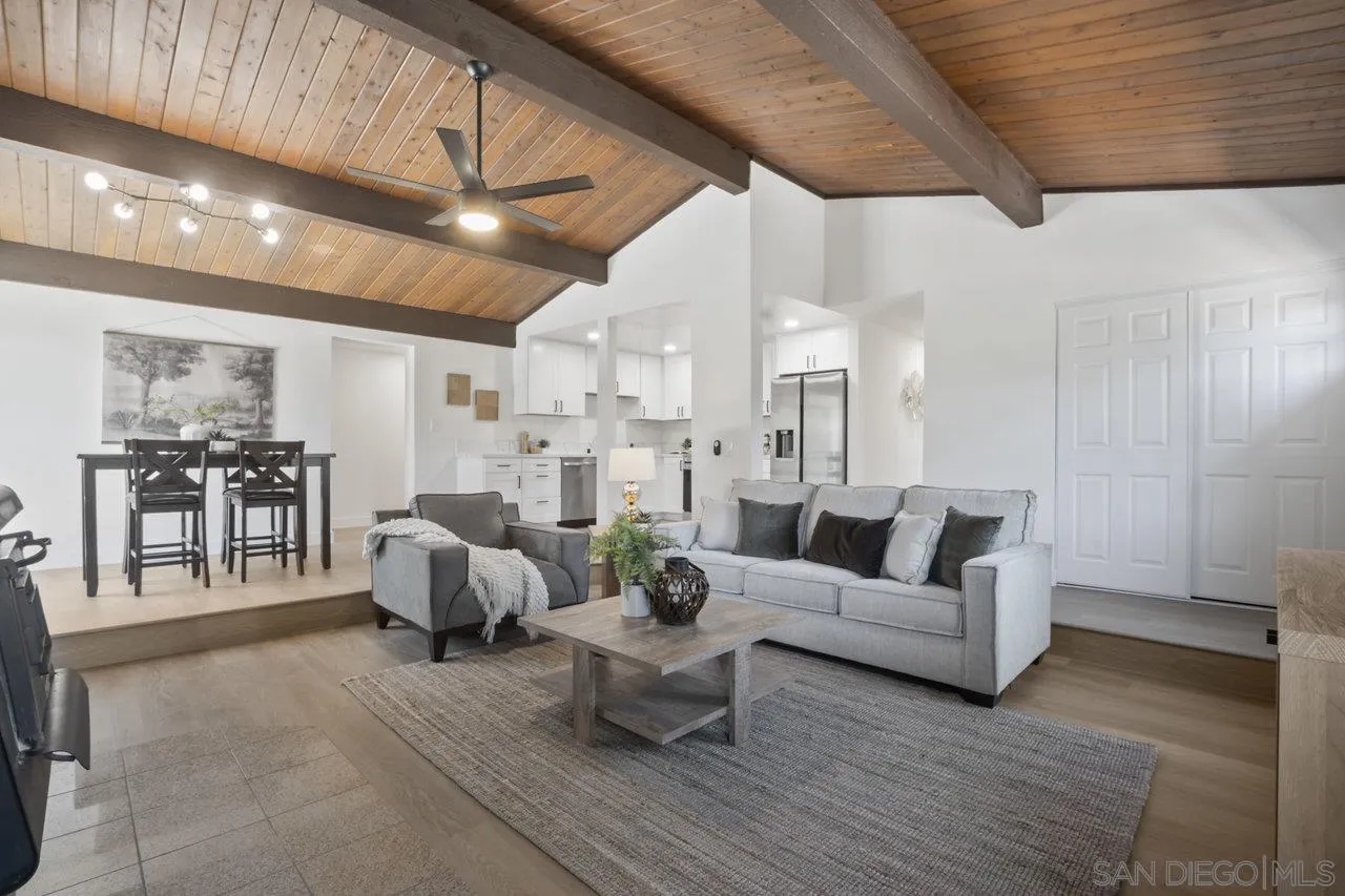 23471 Japatul Valley Road Alpine, CA 91901 - Photo 8 of 57 a living room with furniture white walls and kitchen view