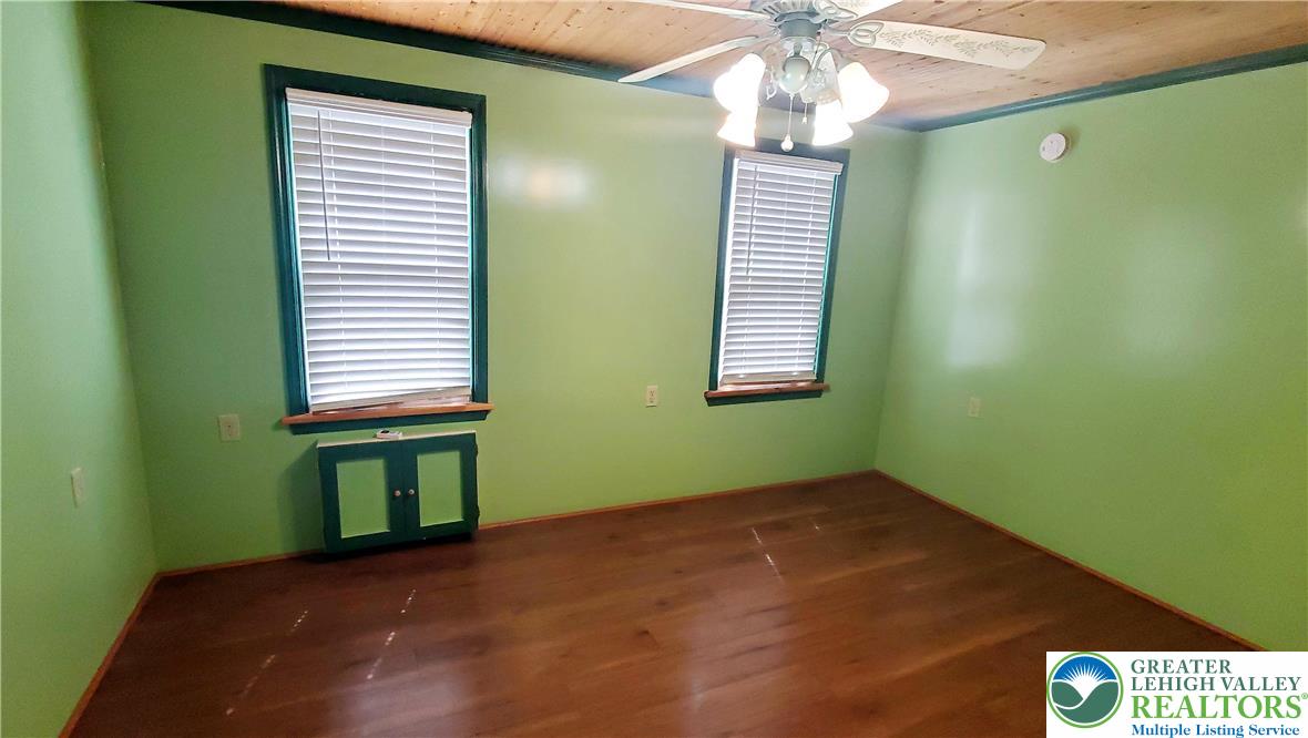 703 Canning Street Bethlehem, PA 18015 - Photo 5 of 14 a view of empty room with window and ceiling fan