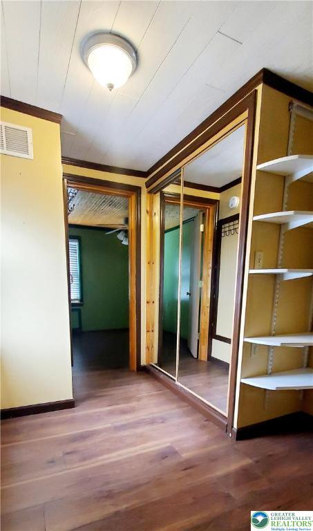 703 Canning Street Bethlehem, PA 18015 - Photo 6 of 14 a view of an empty room with wooden floor and a window