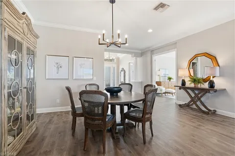 a kitchen with stainless steel appliances white cabinets and a stove