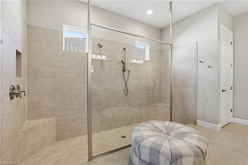 9489 Montelanico Loop Naples, FL 34119 - Photo 23 of 49 Bathroom with a walk in shower and recessed lighting