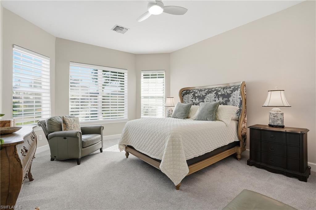 9489 Montelanico Loop Naples, FL 34119 - Photo 24 of 49 Carpeted bedroom with ceiling fan and baseboards