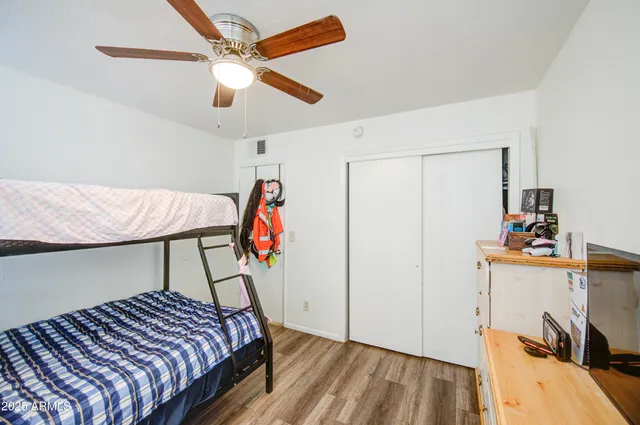 a bedroom with a bed and a dresser