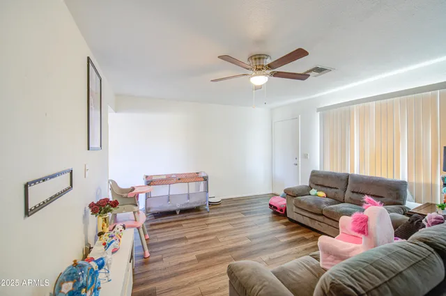 a living room with furniture and a window