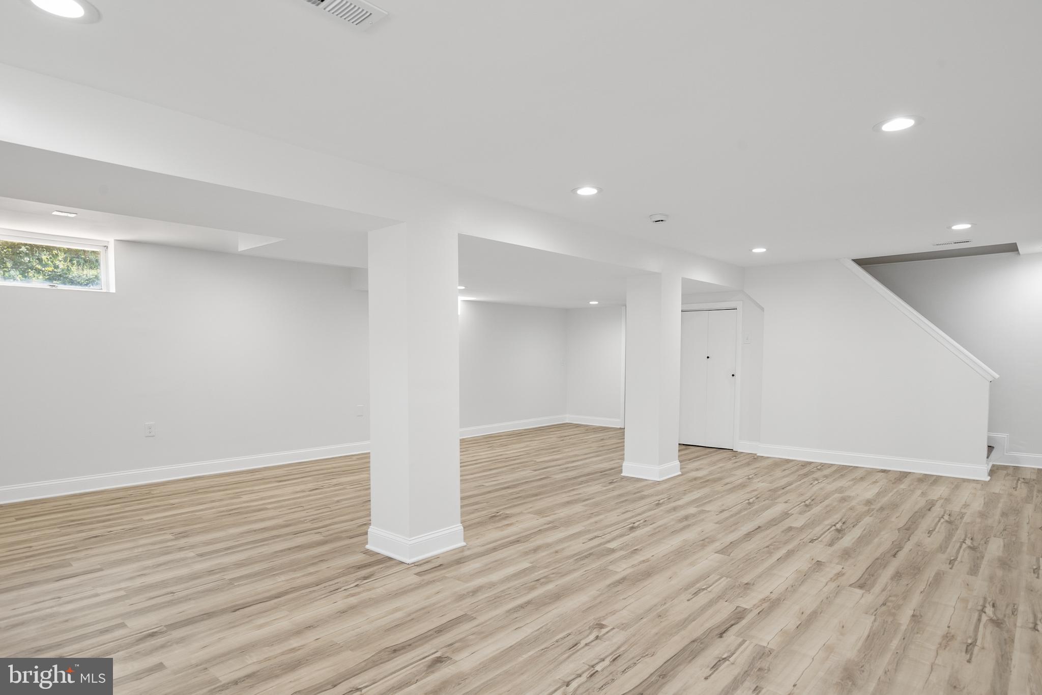 215 East Timonium Road Lutherville-Timonium, MD 21093 - Photo 27 of 33 a view of an empty room with wooden floor