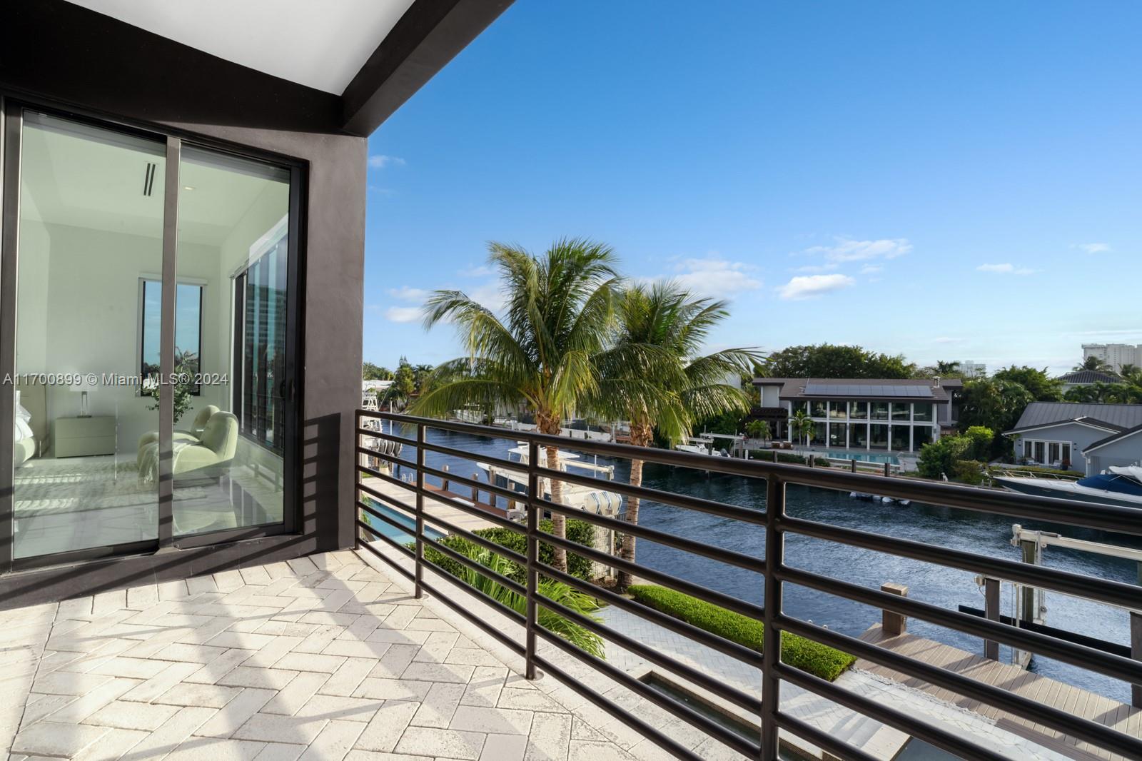 2040 Northeast 121st Road North Miami, FL 33181 - Photo 18 of 43 a view of a balcony with an outdoor seating