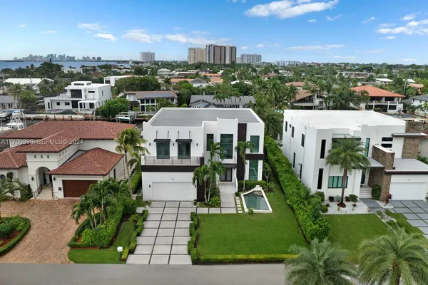 a aerial view of a house with a yard