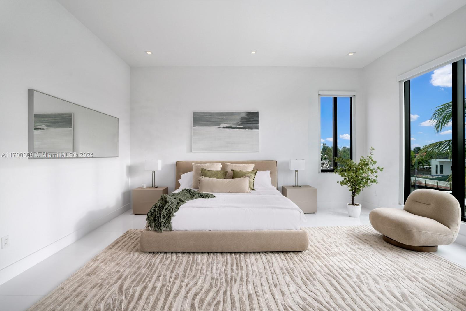 2040 Northeast 121st Road North Miami, FL 33181 - Photo 26 of 43 a bedroom with a bed and a couch