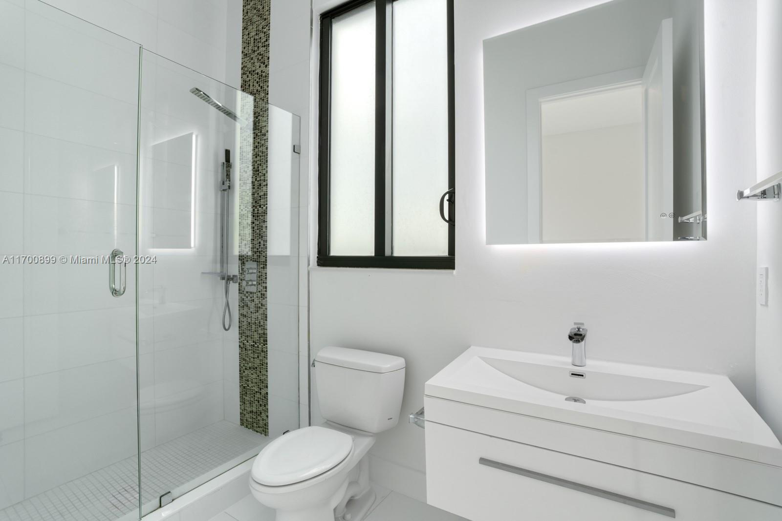 2040 Northeast 121st Road North Miami, FL 33181 - Photo 32 of 43 a bathroom with a sink toilet and shower