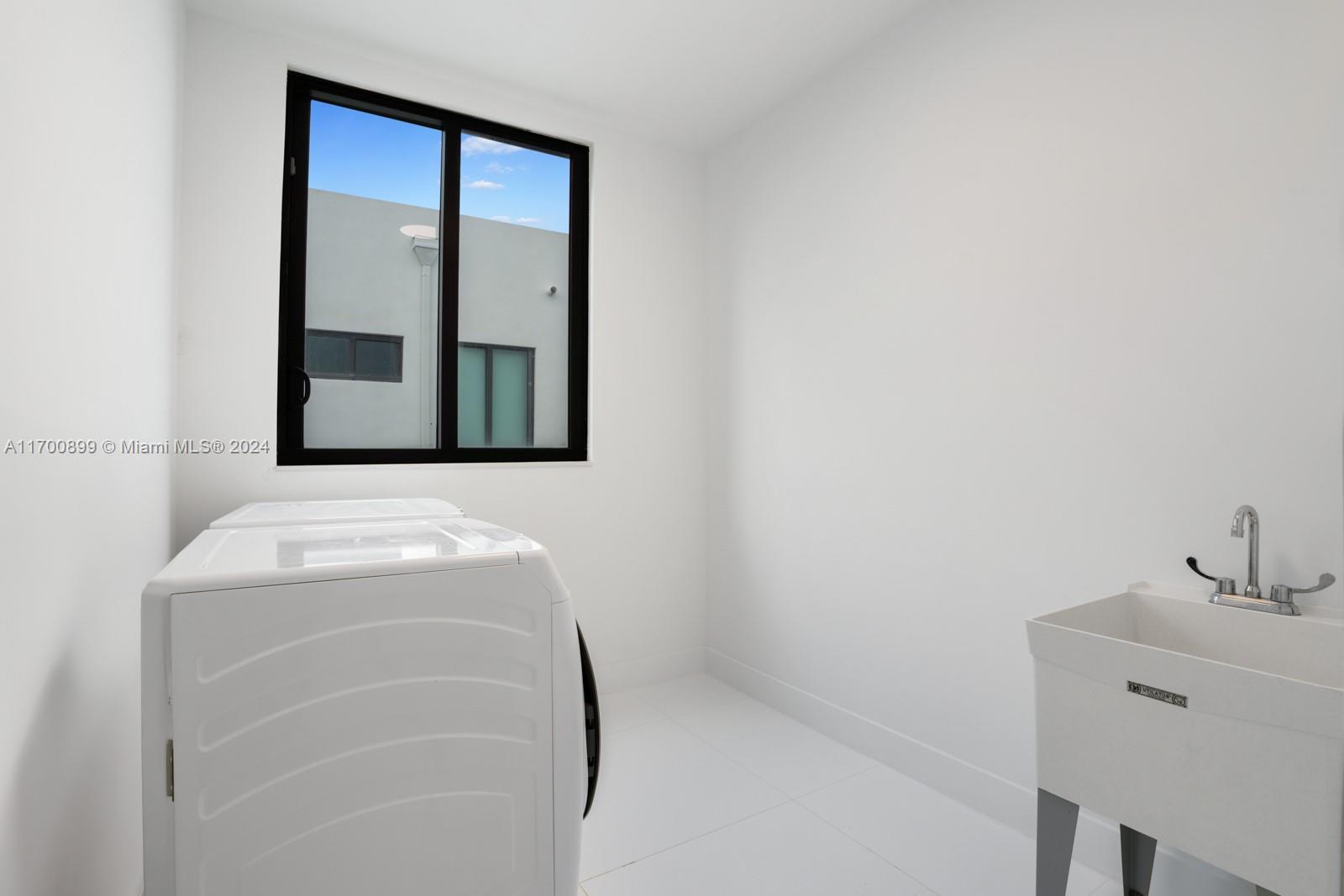 2040 Northeast 121st Road North Miami, FL 33181 - Photo 36 of 43 a bathroom with a sink and mirror