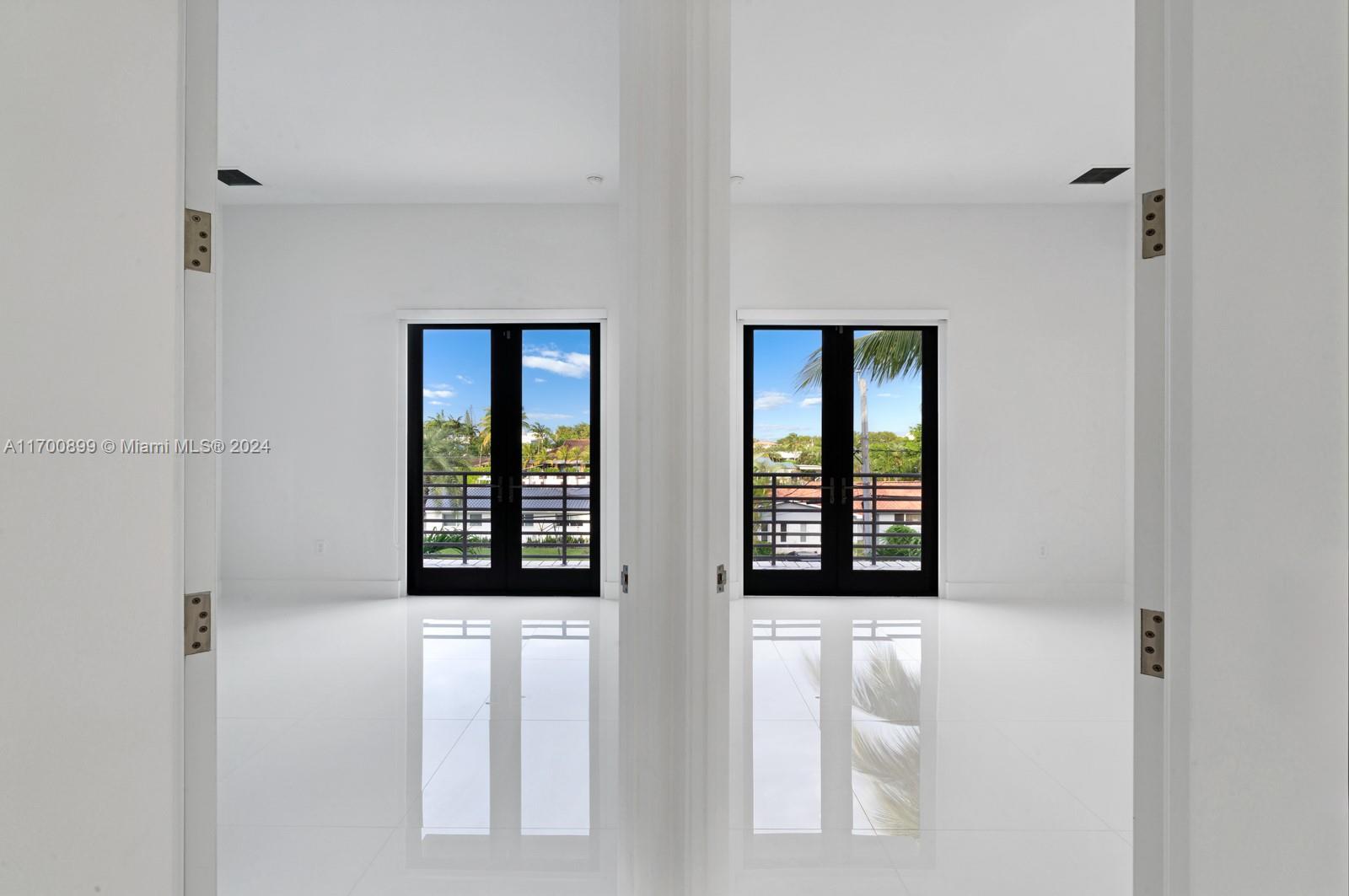 2040 Northeast 121st Road North Miami, FL 33181 - Photo 38 of 43 a view of an empty room with windows and closet