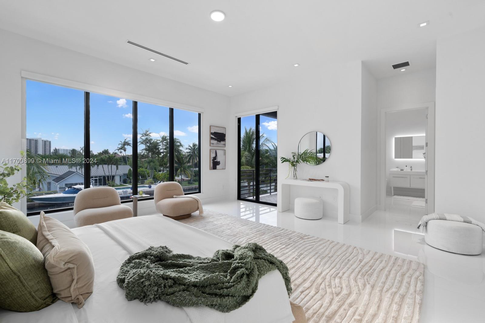 2040 Northeast 121st Road North Miami, FL 33181 - Photo 7 of 43 a bedroom with furniture and a large window