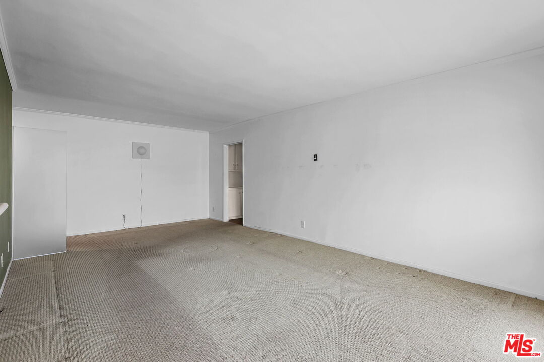 8710 Delgany Avenue, Unit 26 Playa del Rey, CA 90293 - Photo 11 of 25 a view of an empty room and chandelier fan