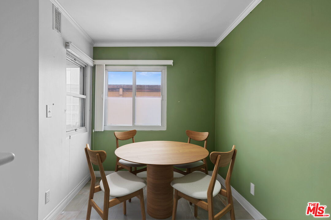 8710 Delgany Avenue, Unit 26 Playa del Rey, CA 90293 - Photo 15 of 25 a view of a dining room with furniture and a window