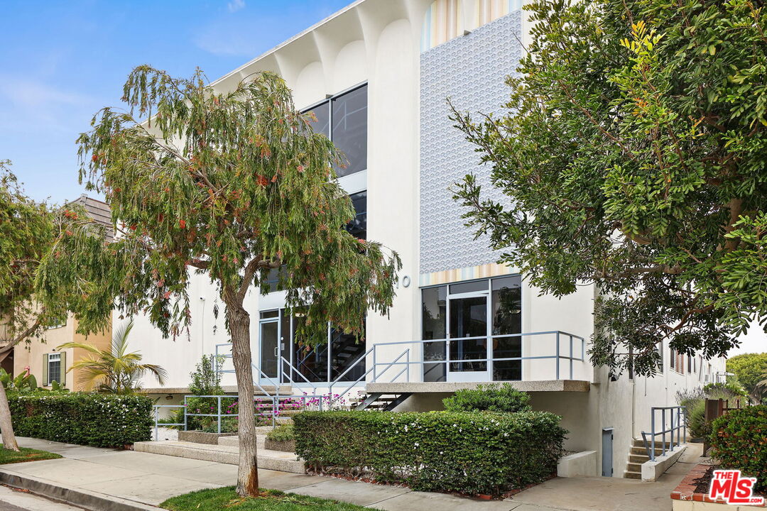 8710 Delgany Avenue, Unit 26 Playa del Rey, CA 90293 - Photo 2 of 25 front view of a house with a yard