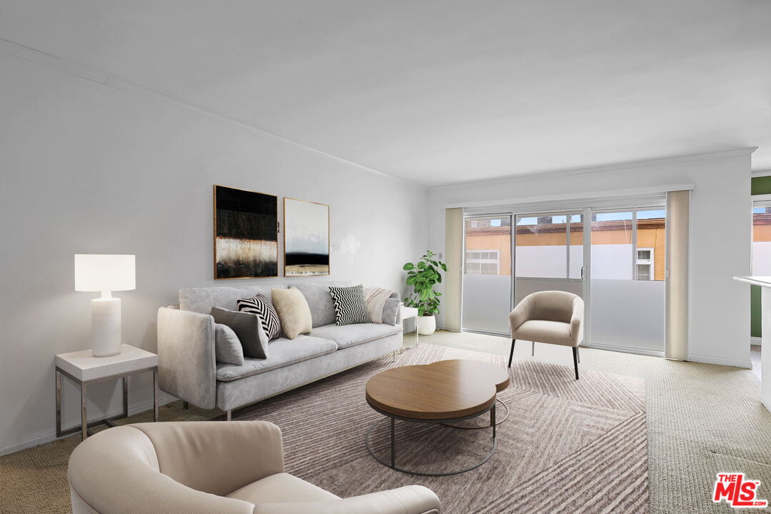 8710 Delgany Avenue, Unit 26 Playa del Rey, CA 90293 - Photo 5 of 25 a living room with furniture and a lamp