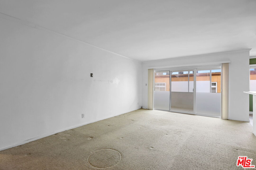 8710 Delgany Avenue, Unit 26 Playa del Rey, CA 90293 - Photo 6 of 25 a view of an empty room with a window