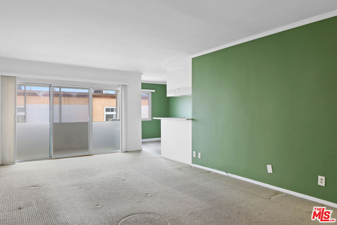 8710 Delgany Avenue, Unit 26 Playa del Rey, CA 90293 - Photo 10 of 25 an empty room with windows and closet