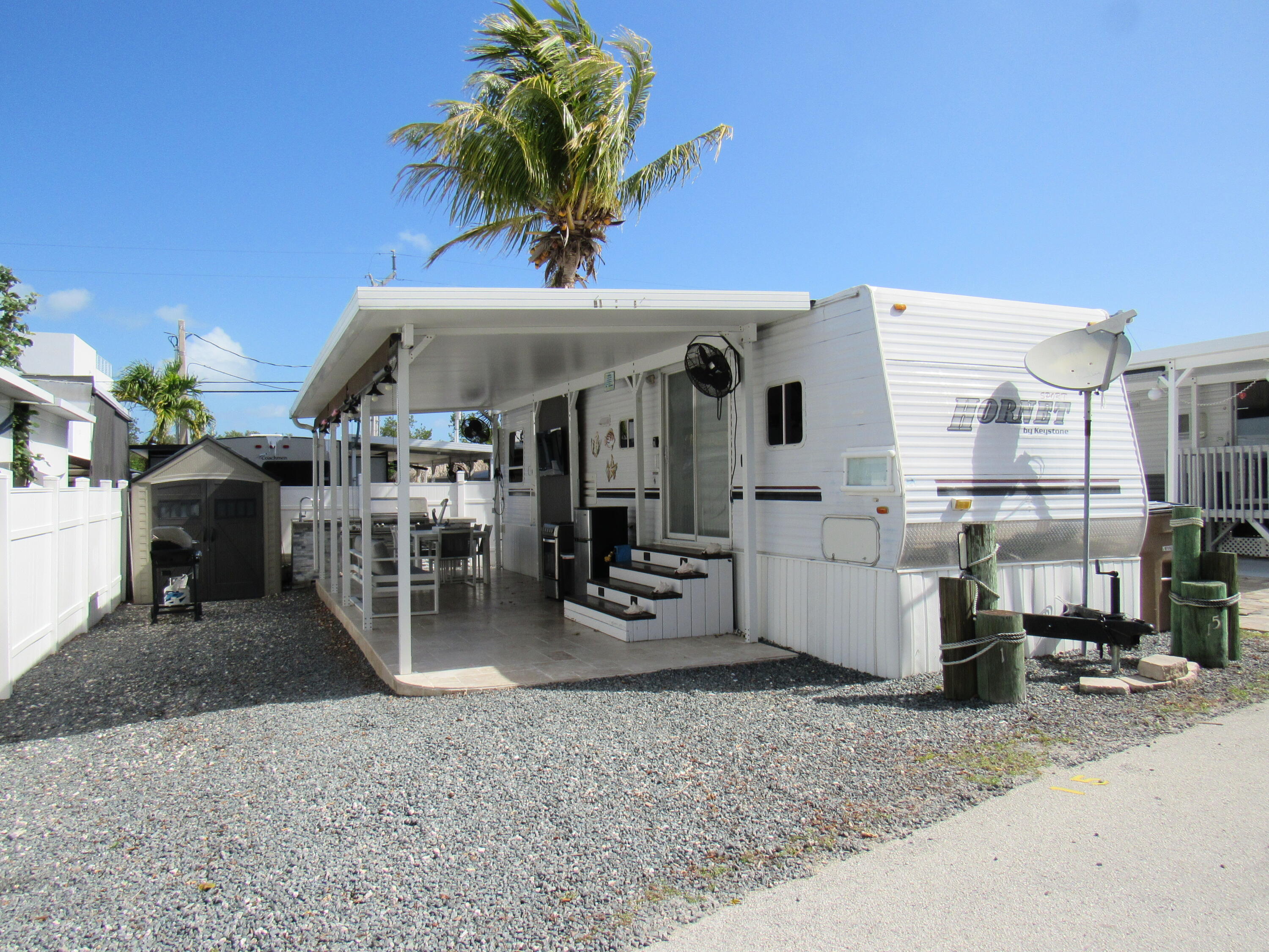 a view of a livingroom with furniture and a floor to ceiling window