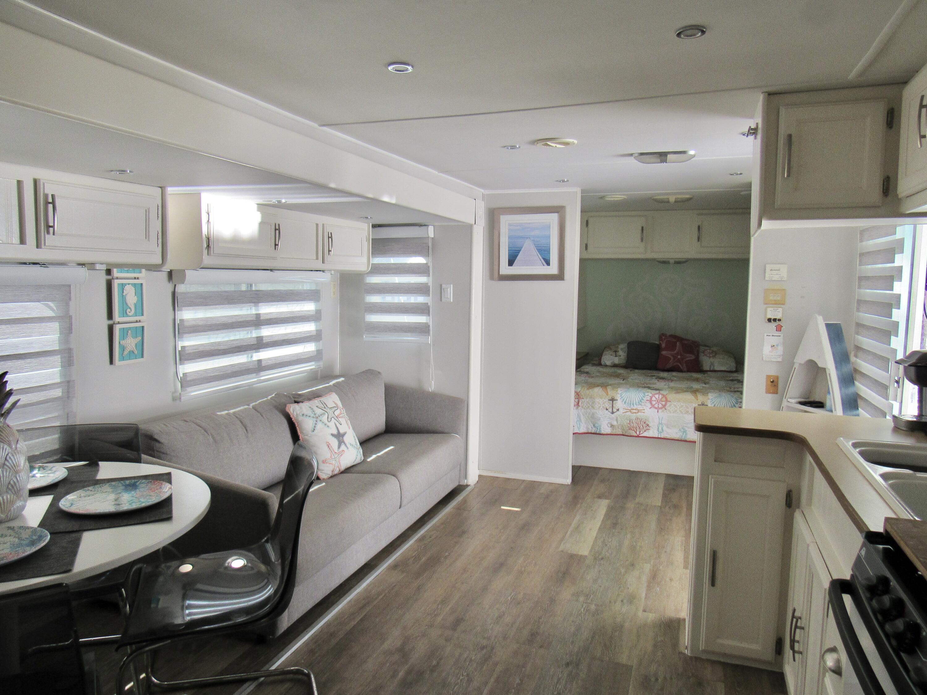 325 Calusa Street, Unit 15 Key Largo, FL 33037 - Photo 13 of 32 a living room with furniture and a table