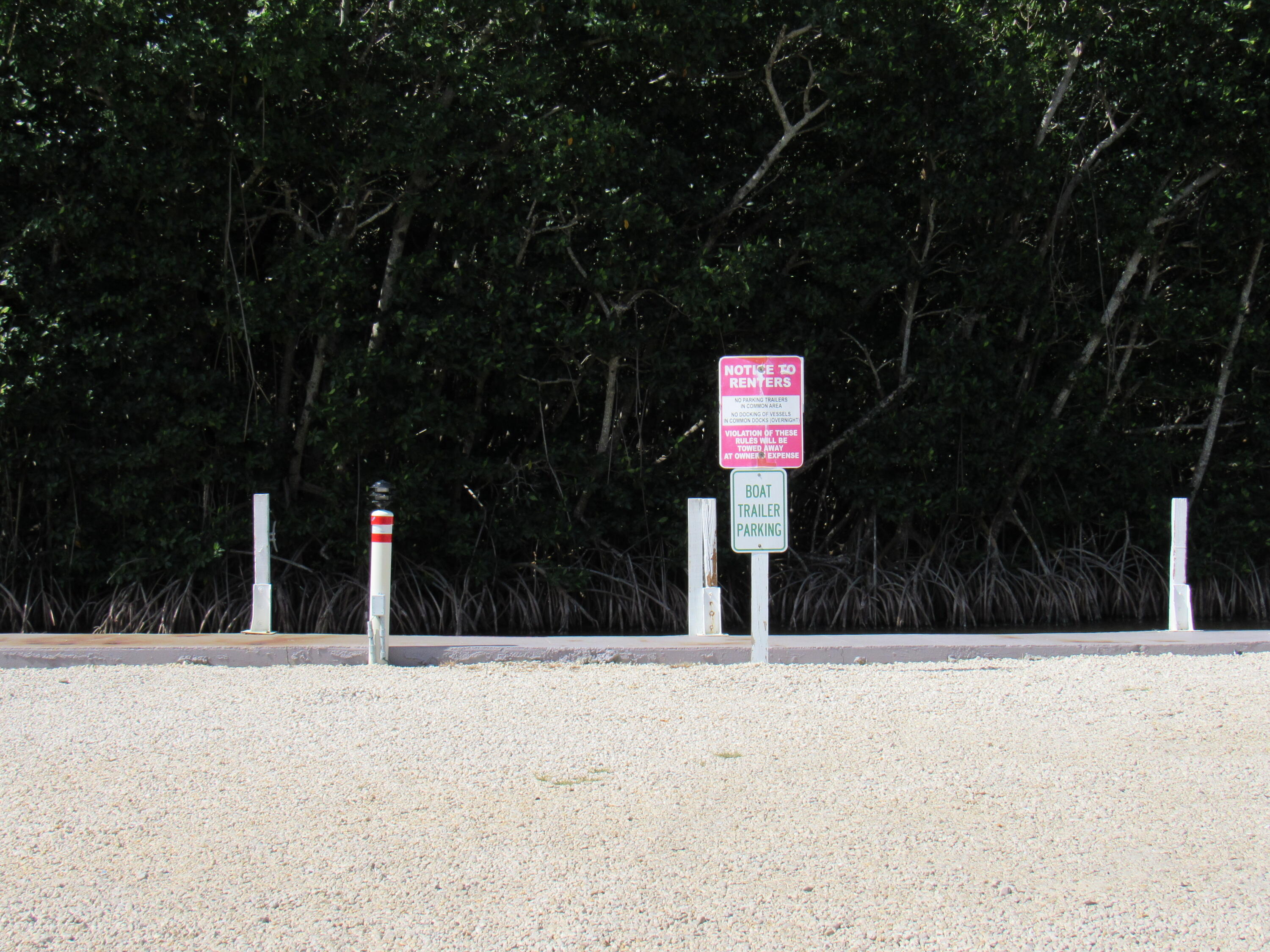 325 Calusa Street, Unit 15 Key Largo, FL 33037 - Photo 20 of 32 a street view with tall trees