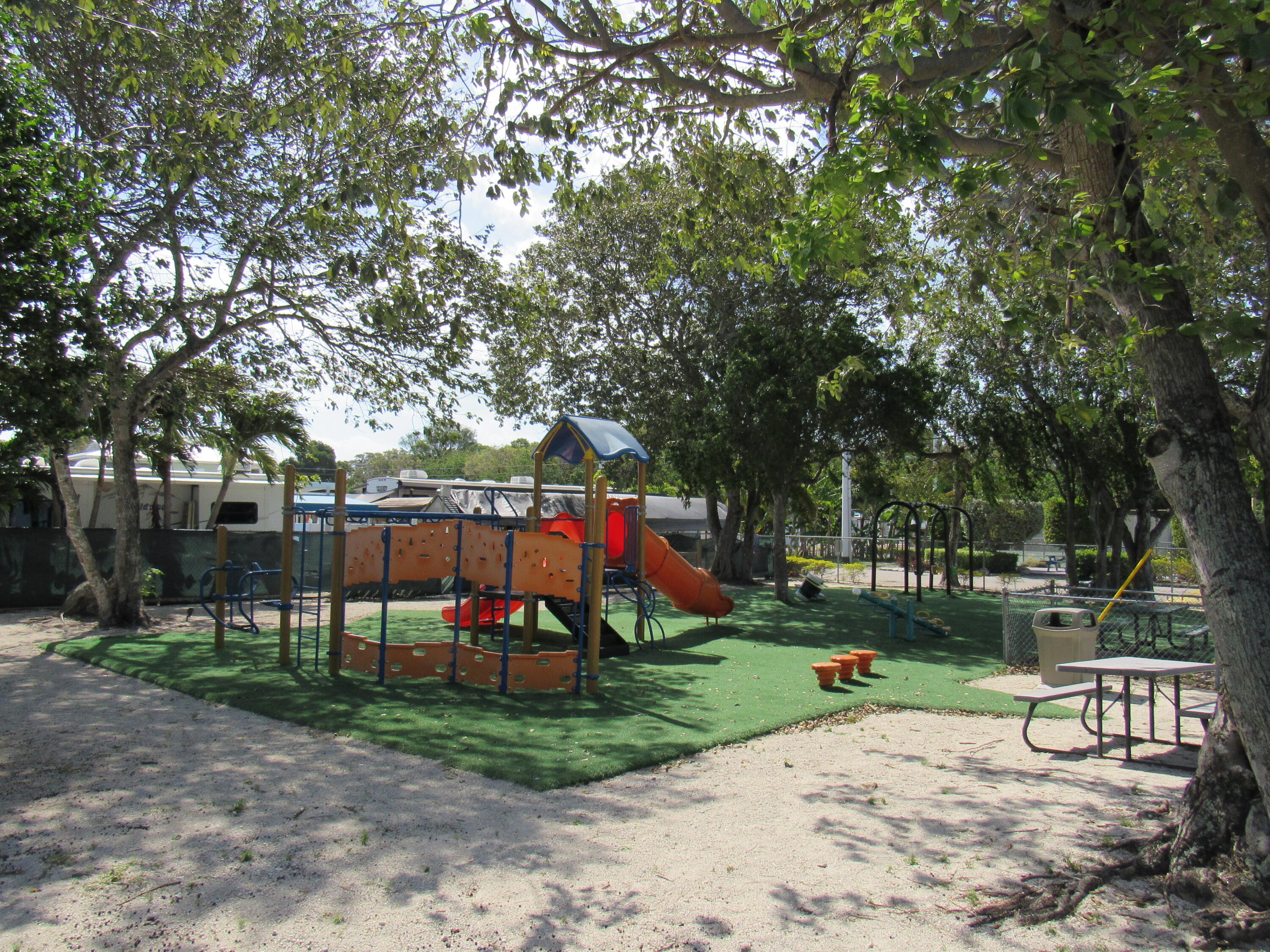325 Calusa Street, Unit 15 Key Largo, FL 33037 - Photo 27 of 32 a view of park with swings and slides
