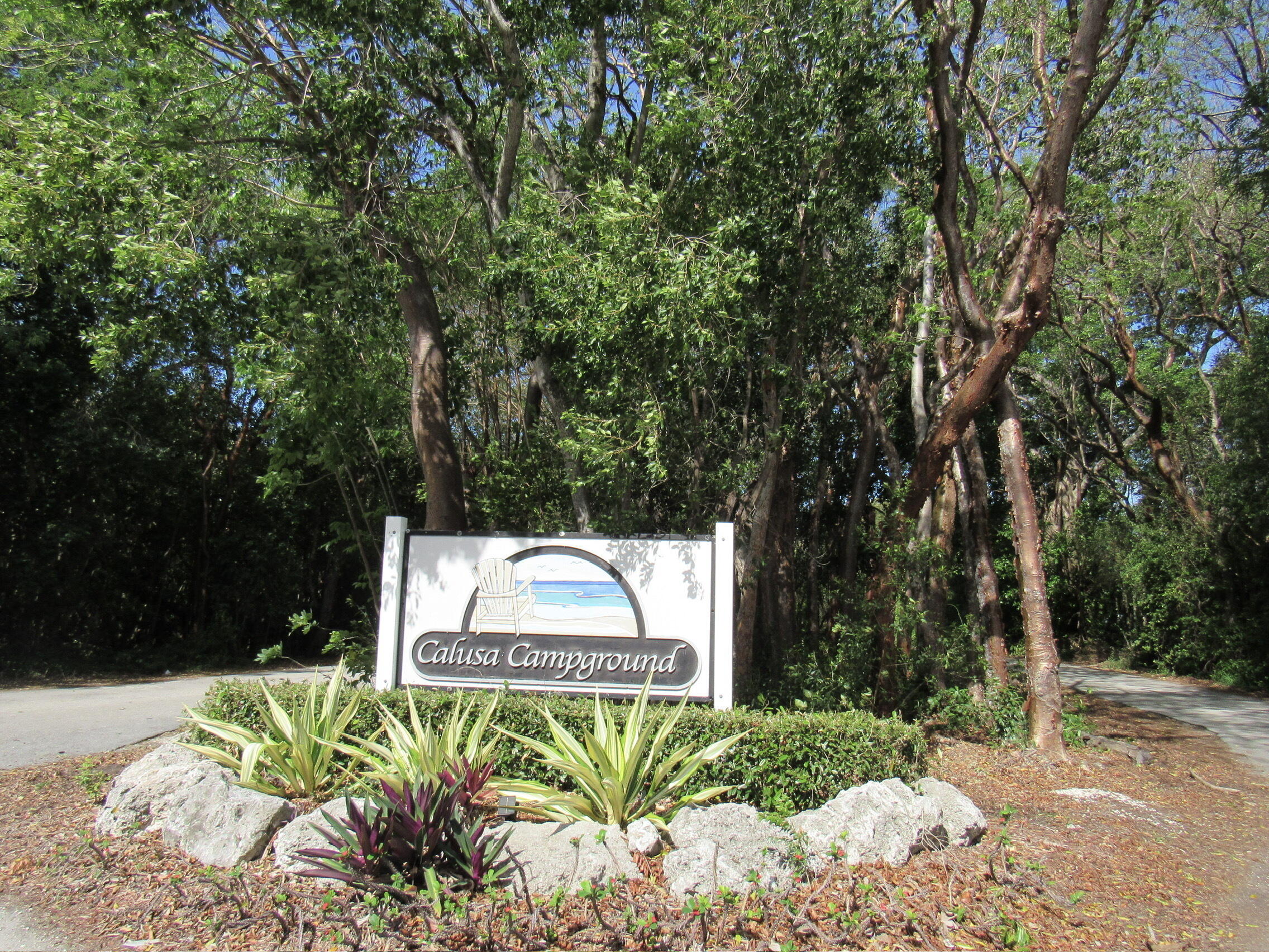 325 Calusa Street, Unit 15 Key Largo, FL 33037 - Photo 32 of 32 a sign that is sitting in the middle of a yard