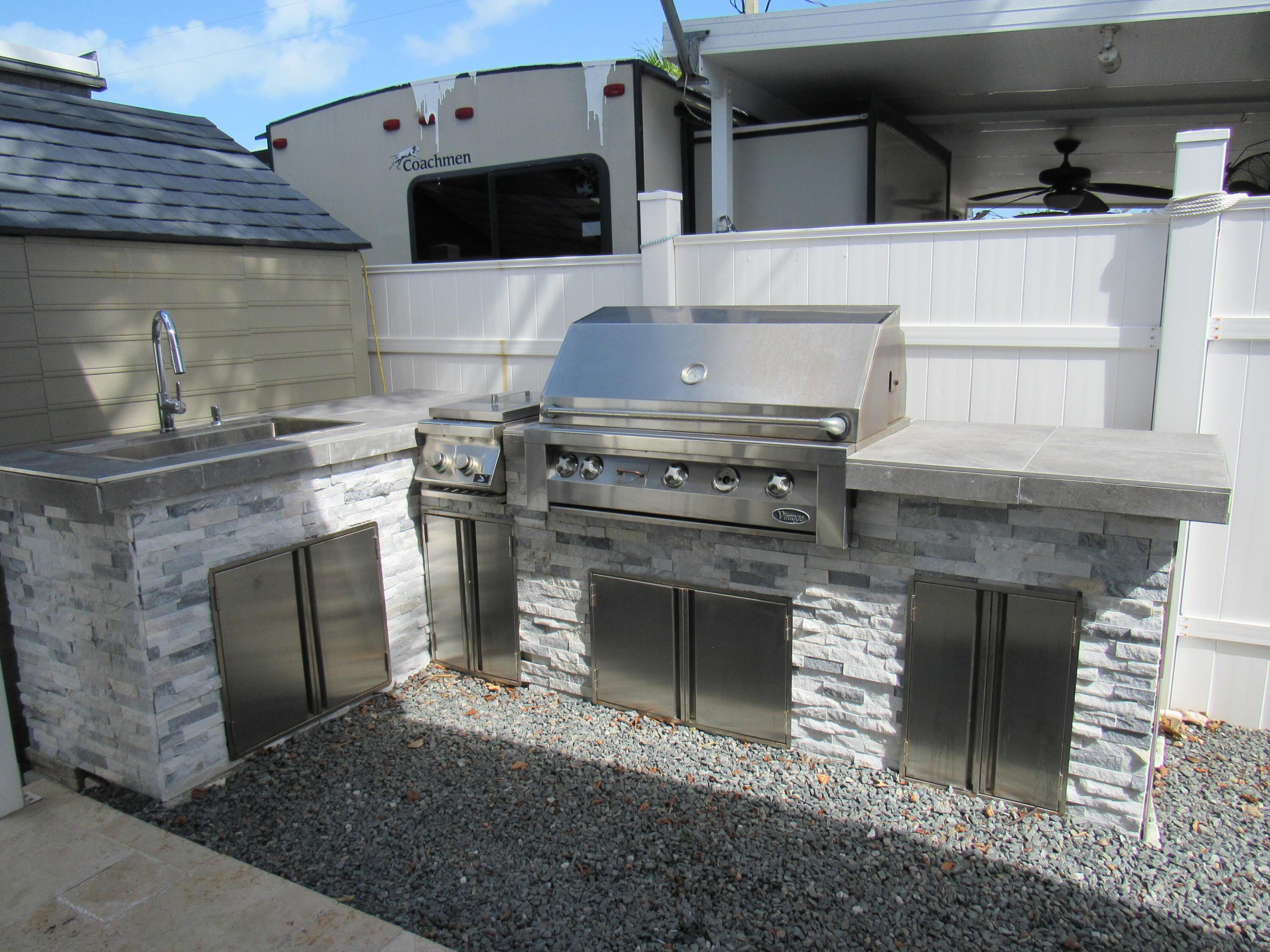 325 Calusa Street, Unit 15 Key Largo, FL 33037 - Photo 6 of 32 a stove top oven sitting inside of a kitchen
