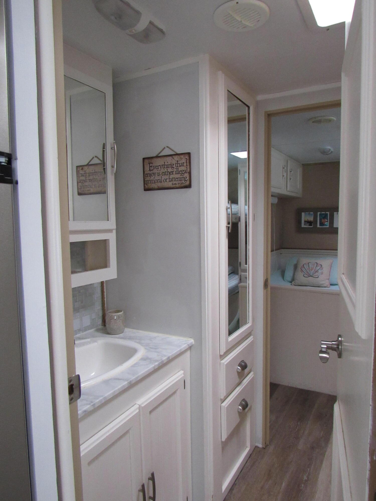 325 Calusa Street, Unit 15 Key Largo, FL 33037 - Photo 7 of 32 a bathroom with a sink and a mirror