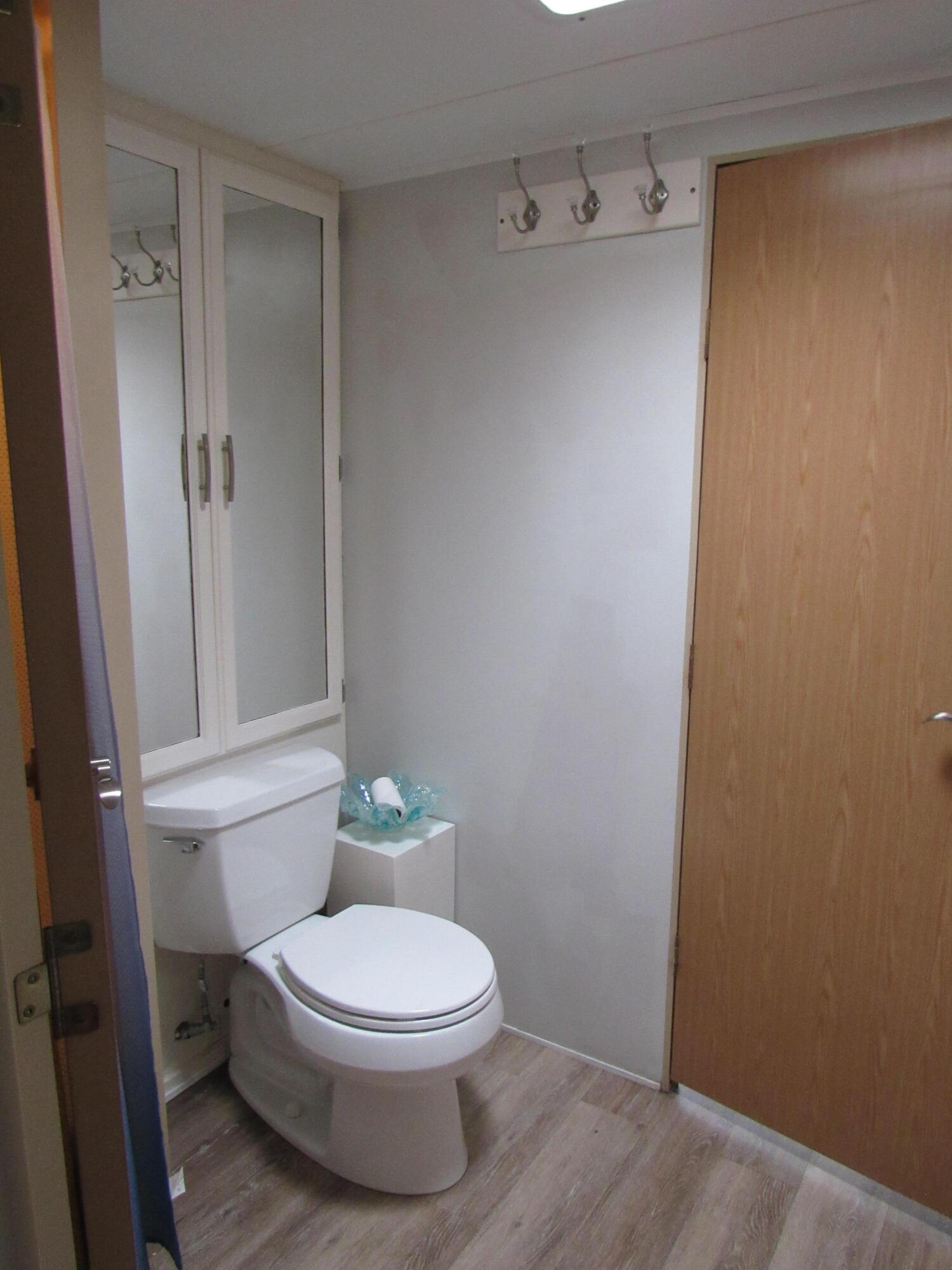 325 Calusa Street, Unit 15 Key Largo, FL 33037 - Photo 9 of 32 a white toilet sitting next to a bathroom sink