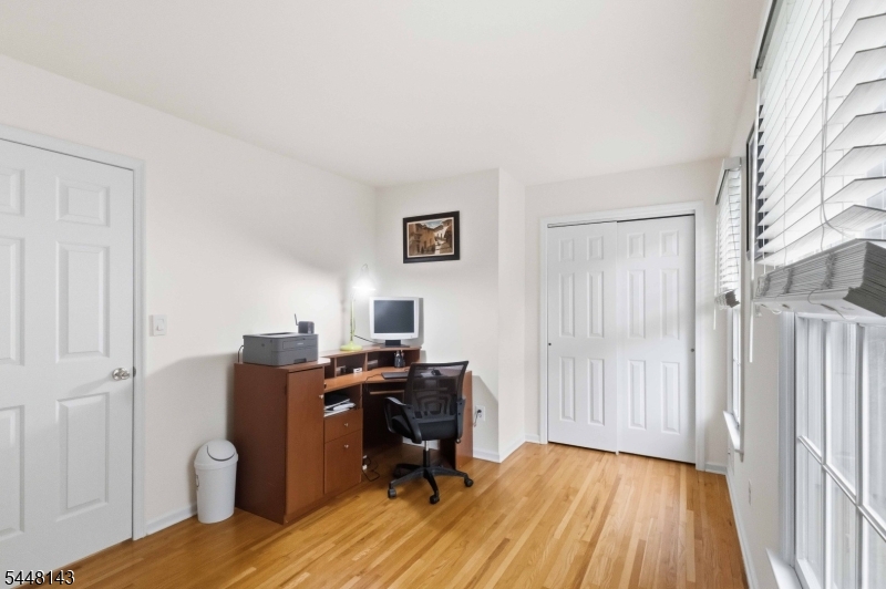 56 Union Hill Road Morris Plains, NJ 07950 - Photo 21 of 31 a view of a workspace with furniture and wooden floor
