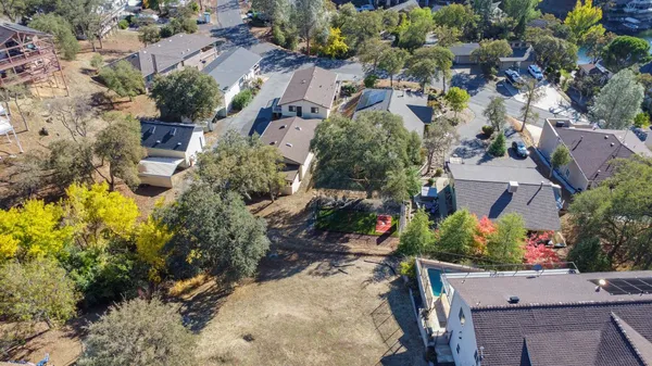 an aerial view of house with yard